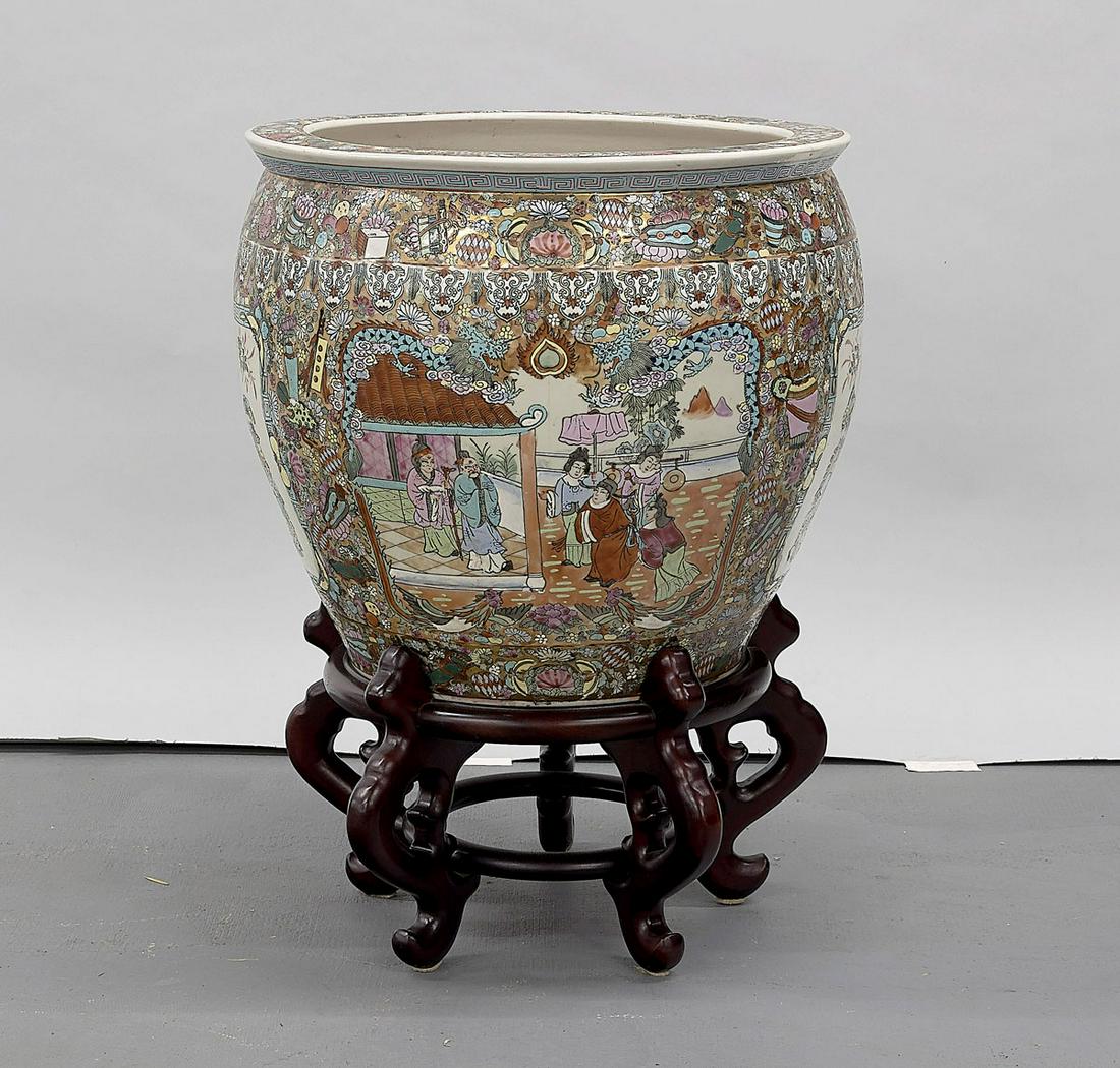 Chinese Famille Rose Porcelain Fish Bowl: Chinese famille rose porcelain fish bowl; with wood stand; ornately designed exterior; fish & plants to interior; hallmark; D: 20"; Due to COVID-19 restrictions, our employees are working remotely. It