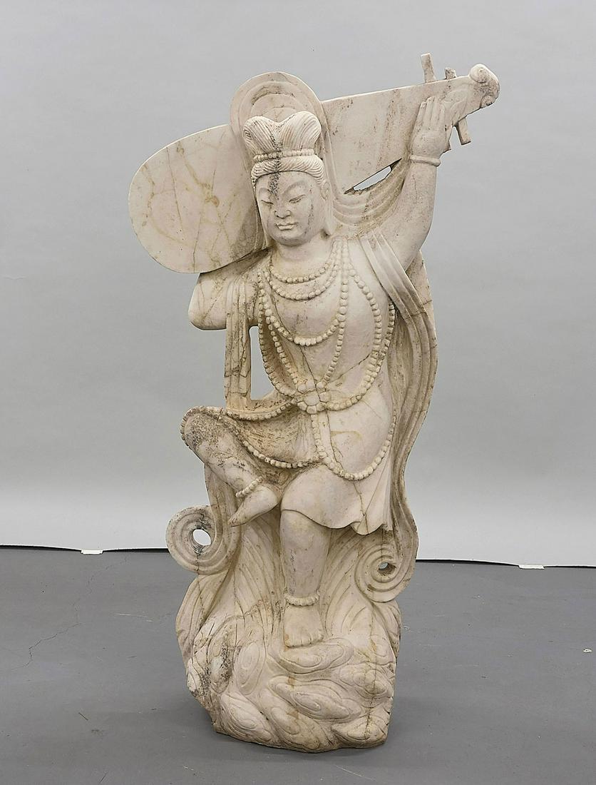 Large Chinese Carved Marble Figure of Guanyin: Large Chinese Tang-style carved marble figure of Guanyin-type figure carrying a musical instrument; H: 53"; Due to COVID-19 restrictions, our employees are working remotely. It may not be possible to