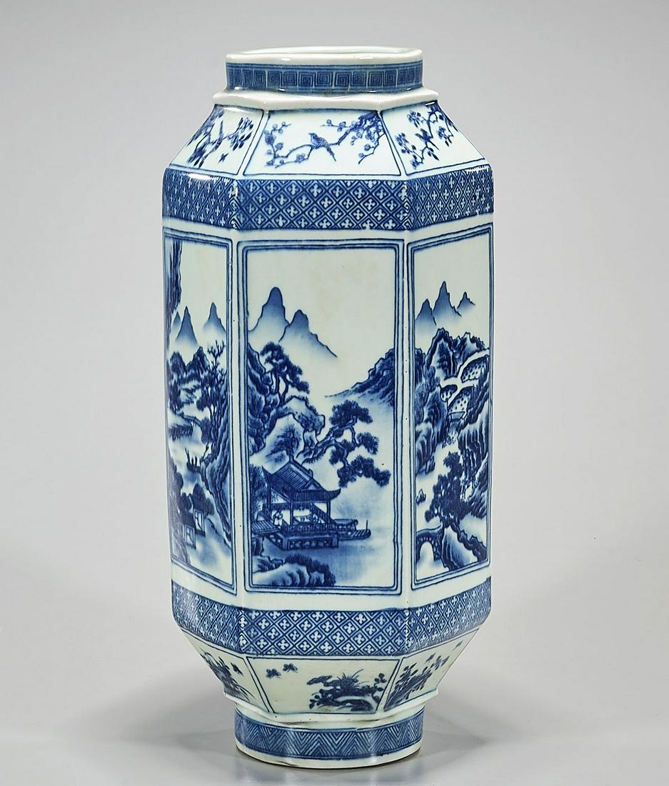 Chinese Blue and White Porcelain Vase: Chinese six-faceted form vase with windowed landscape motifs; Kangxi mark but later; 15" x 7" (approx.)