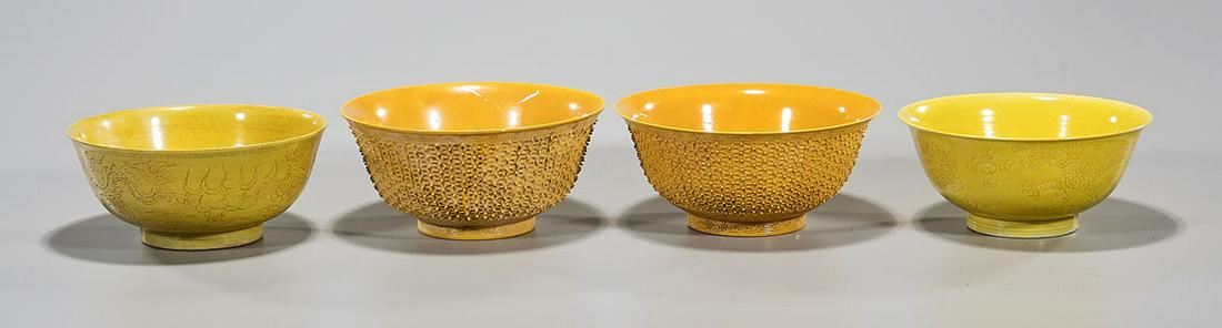Group of Four Chinese Porcelain Bowls: Four Chinese porcelain yellow glazed bowls; 7 1/2" x 3 1/2" (largest, approx.) Condition: general wear, frits, pits