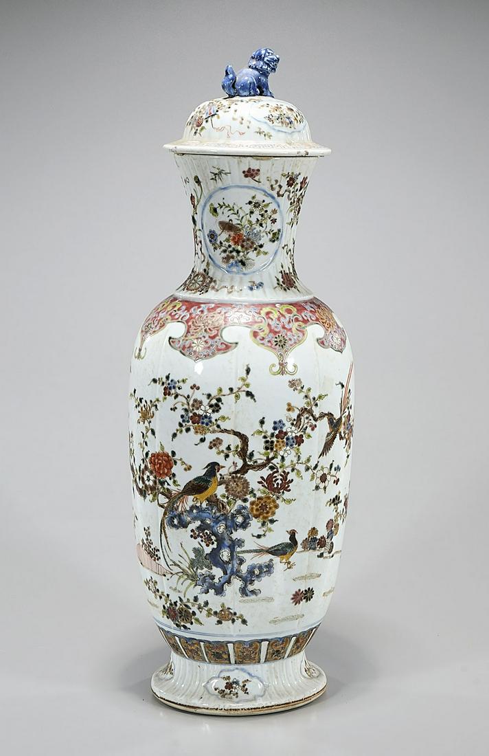 Tall Chinese Enameled Porcelain Vase: Tall Chinese enamaled porcelain vase with flower, bird and butterfly motif; covered; 23" x 8" (approx.) Condition: general wear, frits, pits