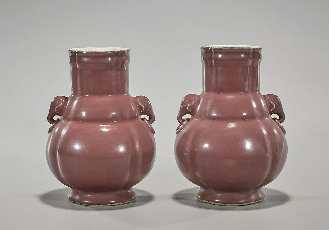 Pair of Chinese Qianlong-Style Red Glazed Vases: Pair of Chinese Qianlong-Style red glazed vases; elephant handles; each with mark, but later; H: each 9" Condition: general wear, frits, pits
