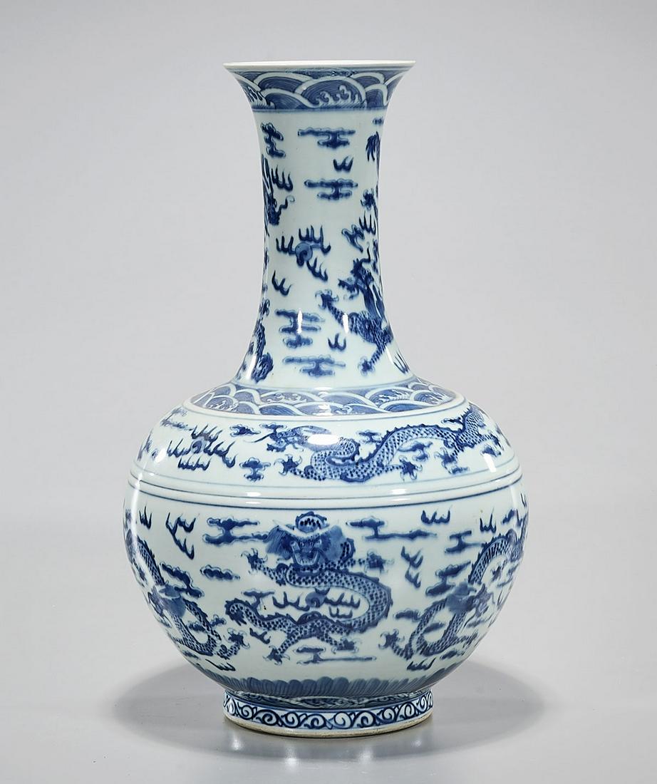 Chinese Blue and White Porcelain Vase: Chinese blue and white porcelain vase with dragon motifs; Guangxu mark but later; 17" x 9" (approx.) Condition: general wear, frits, pits, minor losses