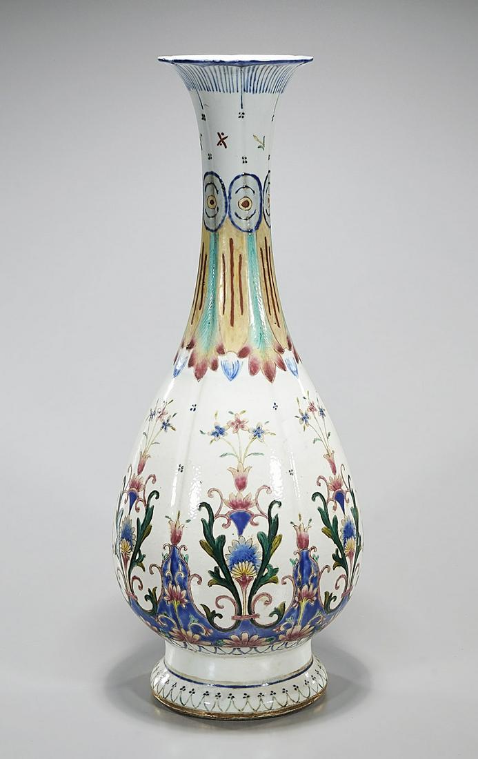 Chinese Enameled Porcelain Vase: Chinese enameled porcelain vase with flower motifs; 23" x 9" (approx.) Condition: general wear, frits, pits, minor losses