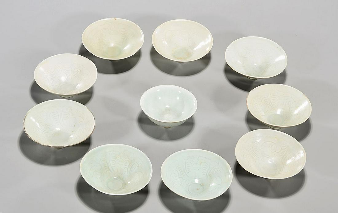 Group of Ten Qingbai Glazed Porcelain Bowls: Ten Chinese qingbai glazed porcelain bowls; D: 5" (largest, approx.) Condition: general wear, frits, pits, minor losses