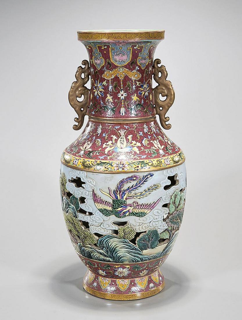 Chinese Enameled Porcelain Core Vase: Chinese elaborate enameled porcelain vase; core depicting children; exterior landscape central motif; 12" x 10" (approx.) Condition: general wear, frits, pits, minor chips