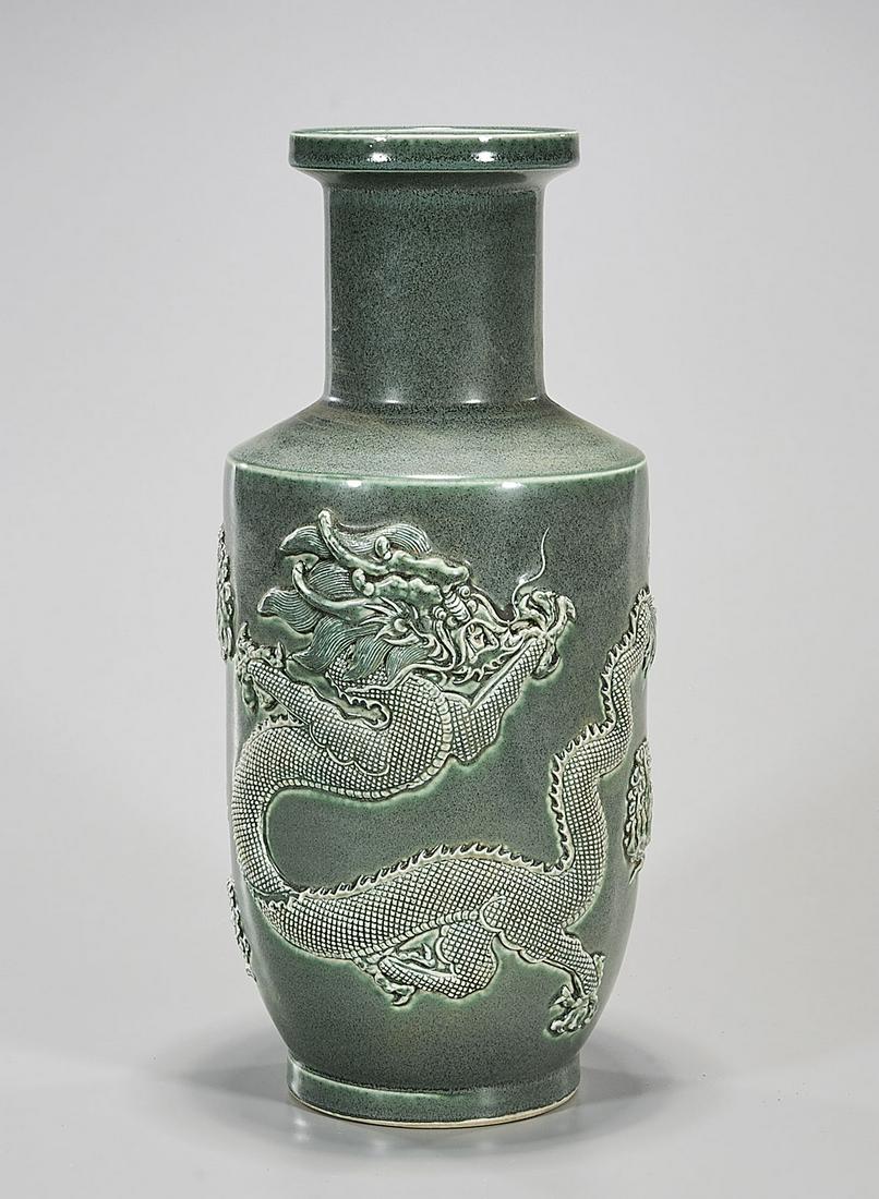 Chinese Green Glazed Porcelain Vase: Chinese green glazed porcelain vase with high relief dragon designs; 18" x 8" (approx.) Condition: general wear, frits, pits, minor chips