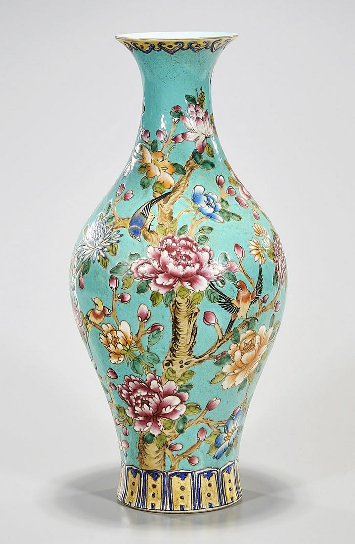 Chinese Enameled Porcelain Vase: Chinese enameled porcelain vase; turquoise ground with flower and butterfly design; 15 1/2" x 8" Condition: general wear, frits, pits, minor chips