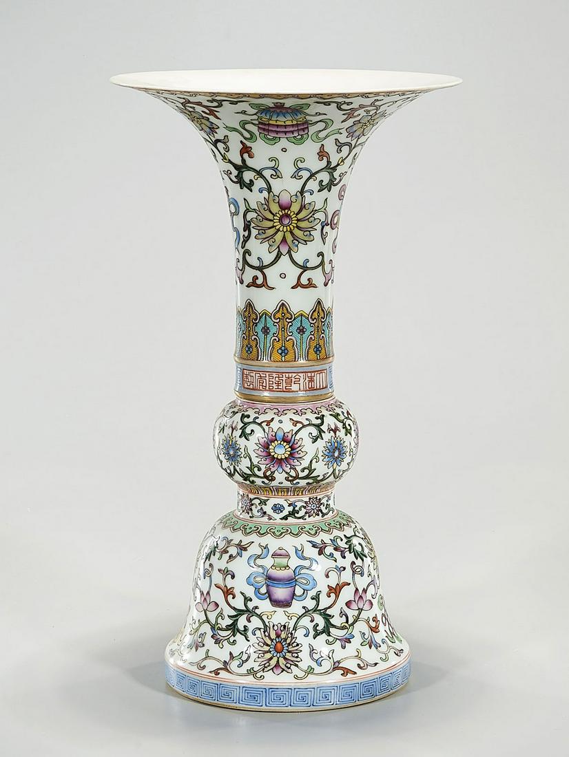 Chinese Enameled Porcelain Vase: Chinese enameled porcelain vase; floral motif; 13" x 8" (approx.) Condition: general wear, frits, pits, minor losses