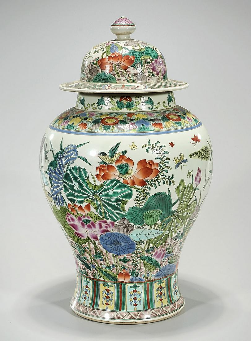 Chinese Enameled Porcelain Covered Jar: Chinese enameled porcelain covered jar; flowers and insects motif; 18 1/" x 10" (approx.) Condition: general wear, frits, pits, minor losses