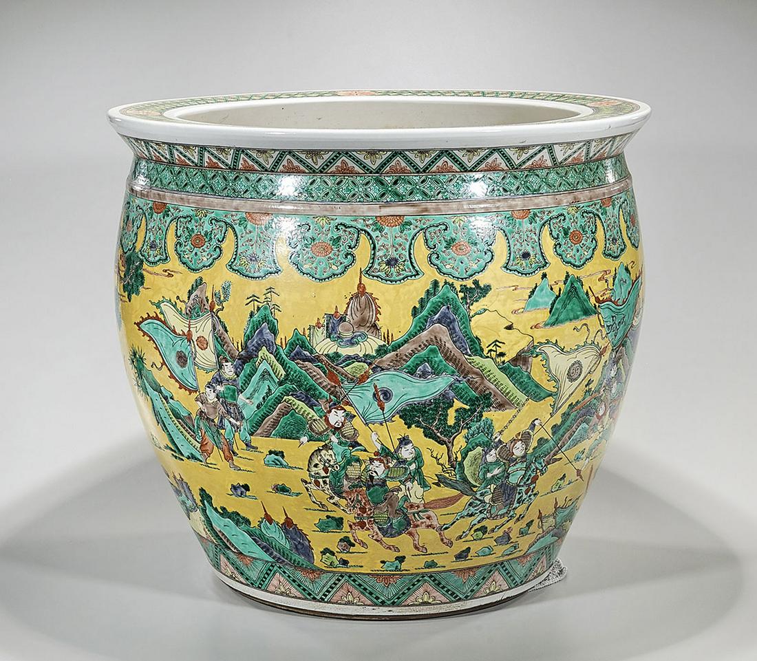 Large Chinese Enameled Porcelain Fish Bowl: Large Chinese enameled porcelain fish bowl; yellow ground with battle scene depictions; 22" x 25" (approx.) Condition: general wear, frits, pits, minor losses