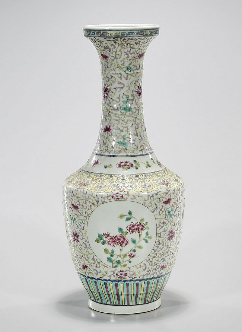 Chinese Enameled Porcelain Vase: Chinese enameled porcelain vase with floral design; 16" x 6 3/4" (approx.) Condition: general wear, frits, pits, minor losses