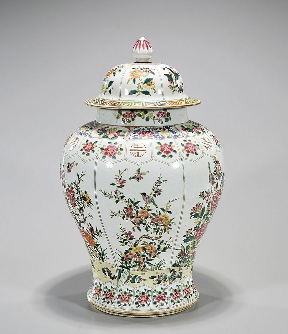 Chinese Enameled Porcelain Covered Jar: Chinese enameled porcelain covered jar; floral and bird motifs; characters to shoulder; 20" x 12" (approx.) Condition: general wear, frits, pits, minor chips