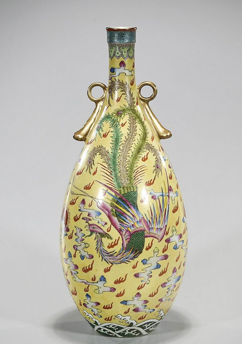 Chinese Enameled Porcelain Vase: Chinese yellow ground porcelain vase with phoenix above water motif; 19" x 7" (approx.) Condition: general wear, frits, pits, minor chips
