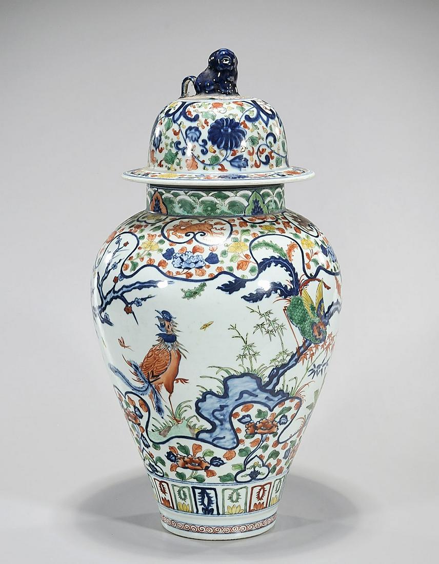 Chinese Doucai Porcelain Covered Vase: Chinese Doucai porcelain covered vase; tree, floral and bird design; 20" x 10" (approx.) Condition: general wear, frits, pits, minor chips