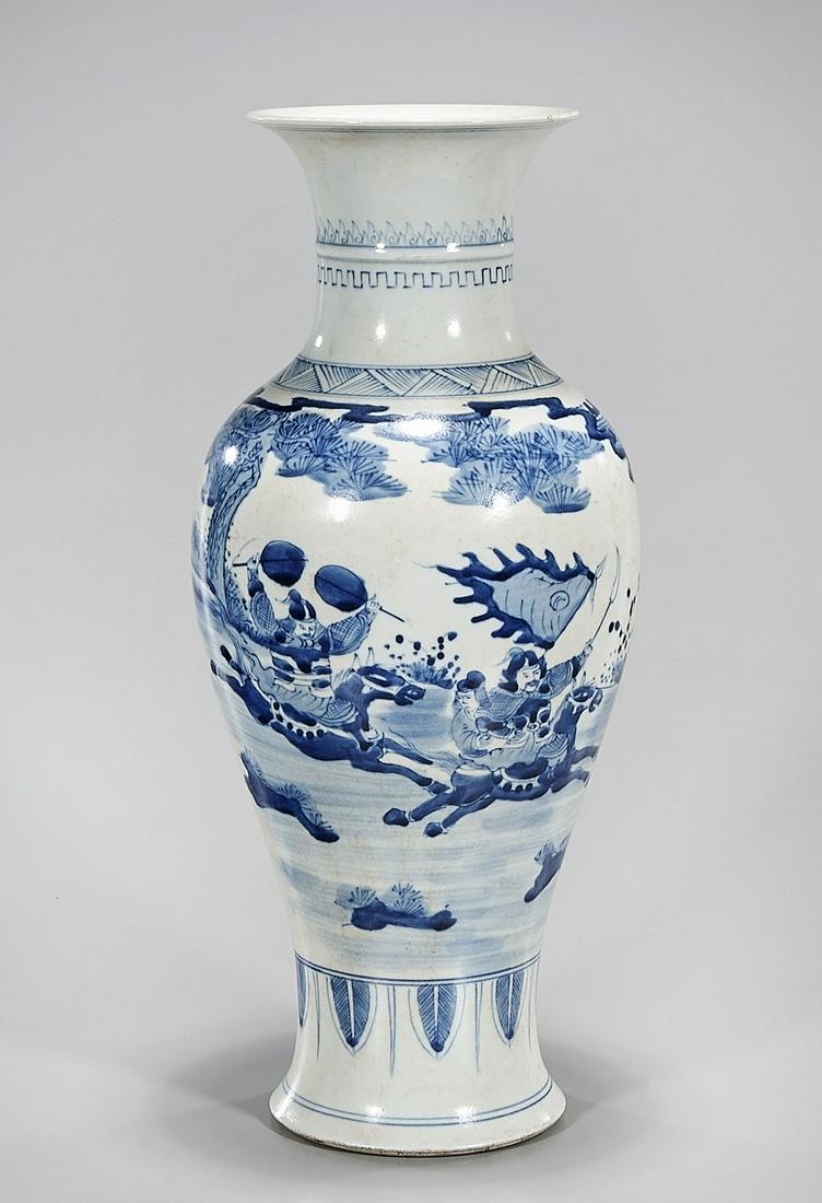 Chinese Blue and White Porcelain Vase: Chinese blue and white porcelain vase depicting battle scene; 16" x 6" (approx.) Condition: general wear, frits, pits, minor chips