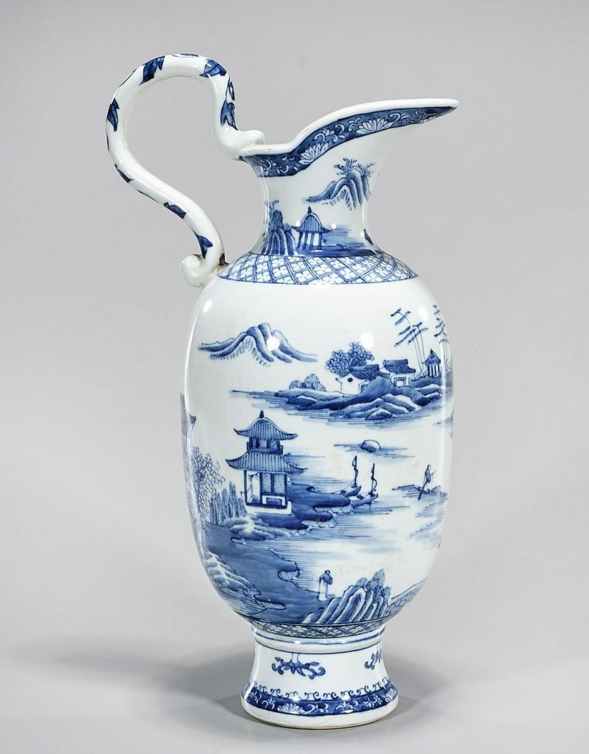 Chinese Blue and White Porcelain Pitcher: Chinese blue and white porcelain pitcher with landscape design; 15" x 9" x 6" (approx.) Condition: general wear, frits, pits, minor chips