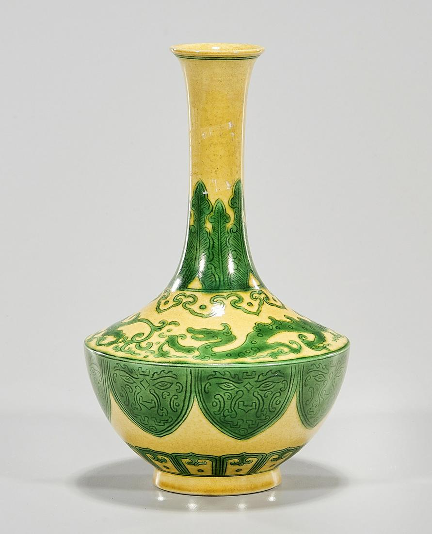 Chinese Enameled Porcelain Vase: Chinese enameled porcelain yellow and green vase; 7" x 4" (approx.) Condition: general wear, frits, pits, minor losses