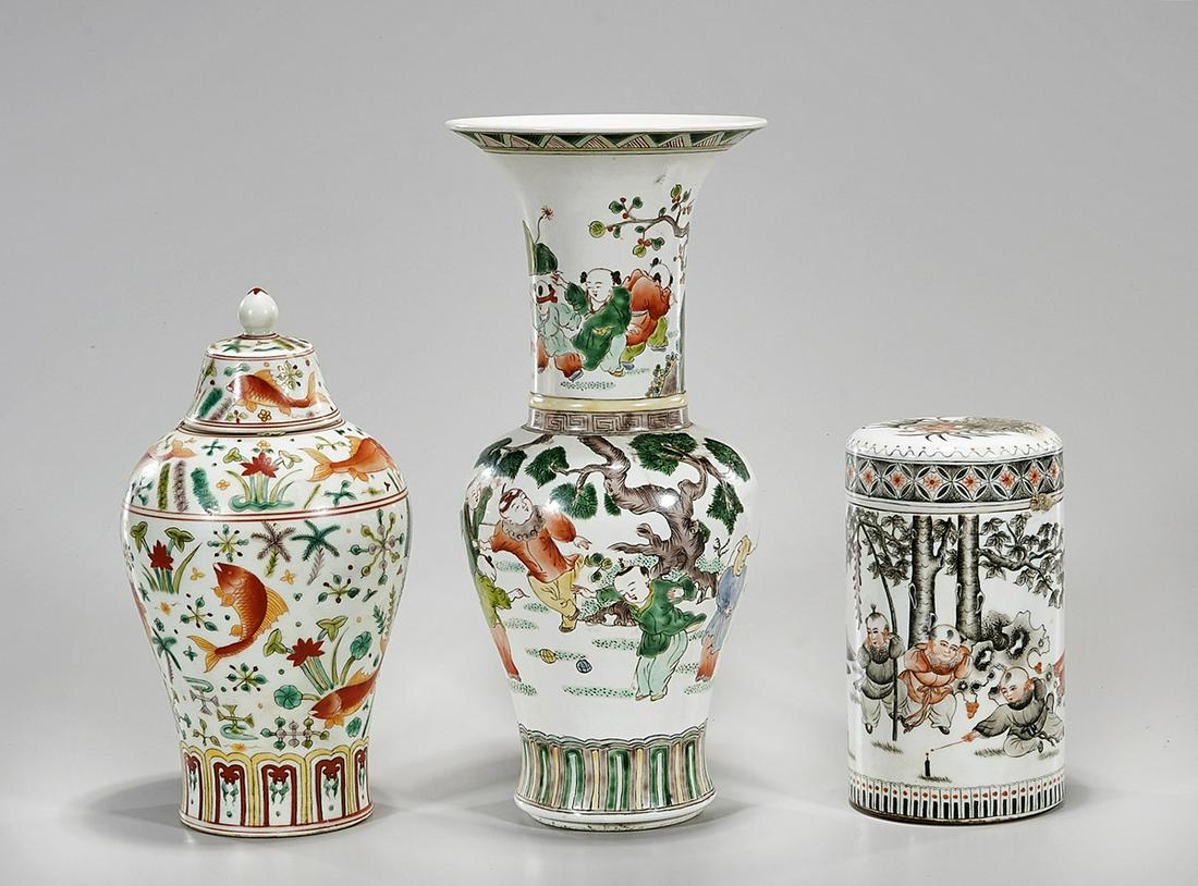 Group of Three Chinese Enameled Porcelain Pieces: Three Chinese enameled porcelains, including a gu-form vase, a covered vase and a covered container; 12" x 5" (approx.) Condition: general wear, frits, pits, minor losses