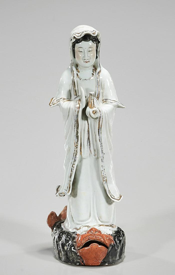 Chinese Porcelain Guanyin Figure: Chinese porcelain Guanyin figure; mark to base; 14" x 5 1/2" x 4" (approx.) Condition: general wear, frits, pits, minor losses