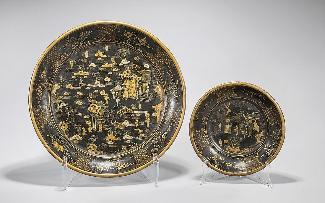 Two Chinese Lacquered Dishes: Two Chinese lacquered pieces; including a deep dish and a charger; landscapes with figures and floral motifs; D: 18" (larger, approx.) Condition: general wear, frits, pits, minor losses