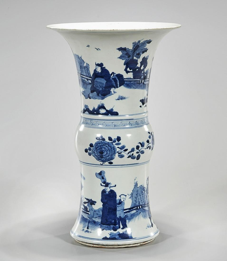 Chinese Blue and White Porcelain Gu-Form Vase: Chinese blue and white porcelain gu-form vase with figures in landscape; 13 1/2" x 8" (approx.) Condition: general wear, frits, pits, minor losses