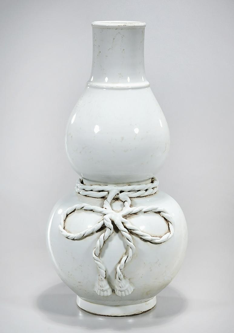 Chinese Porcelain Double Gourd Vase: Chinese porcelain double gourd vase with relief rope design; 23" x 11" (approx.) Condition: general wear, frits, pits, minor losses