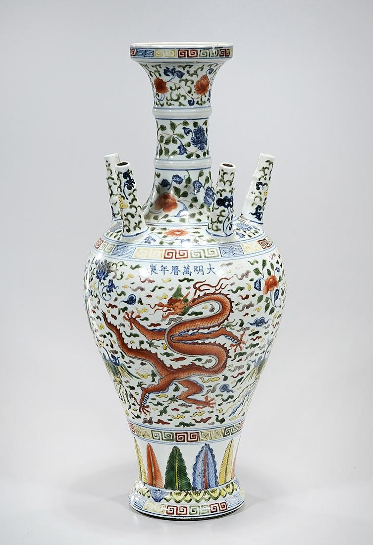 Chinese Wucai Porcelain Vase: Chinese wucai porcelain vase with pipes to shoulder and dragon and phoenix motif; Wanli mark; 20" x 9" (approx.) Condition: general wear, frits, pits, minor losses