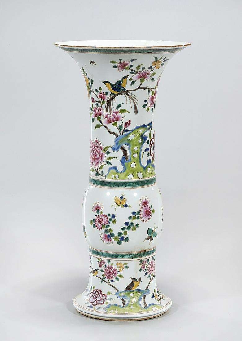 Chinese Enameled Porcelain Gu-Form Vase: Chinese enameled porcelain gu-form vase; depicting flowers, birds and butterflies; 15 1/2" x 8" (approx.) Condition: general wear, frits, pits, minor losses