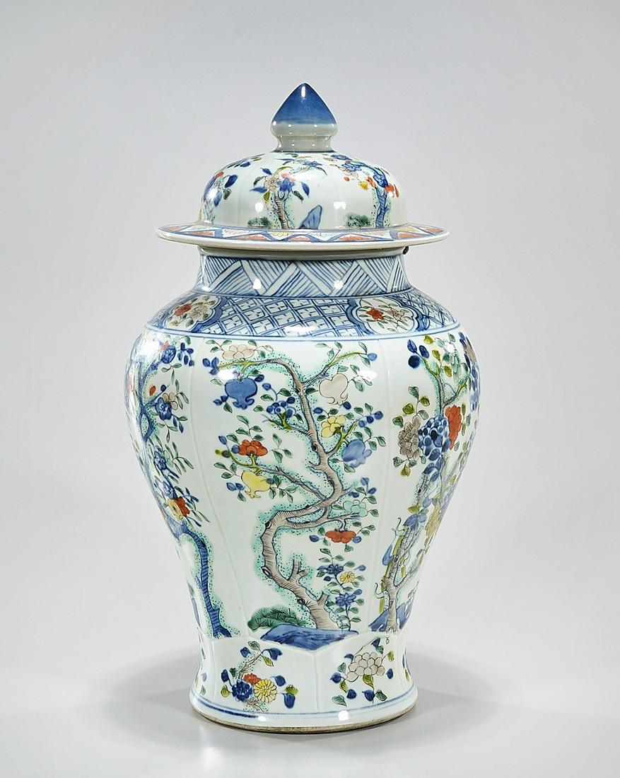 Chinese Enameled Porcelain Covered Vase: Chinese enameled porcelain covered vase; registers with tree and flower motifs; mark to base; 15" x 8" (approx.) Condition: general wear, frits, pits, minor losses