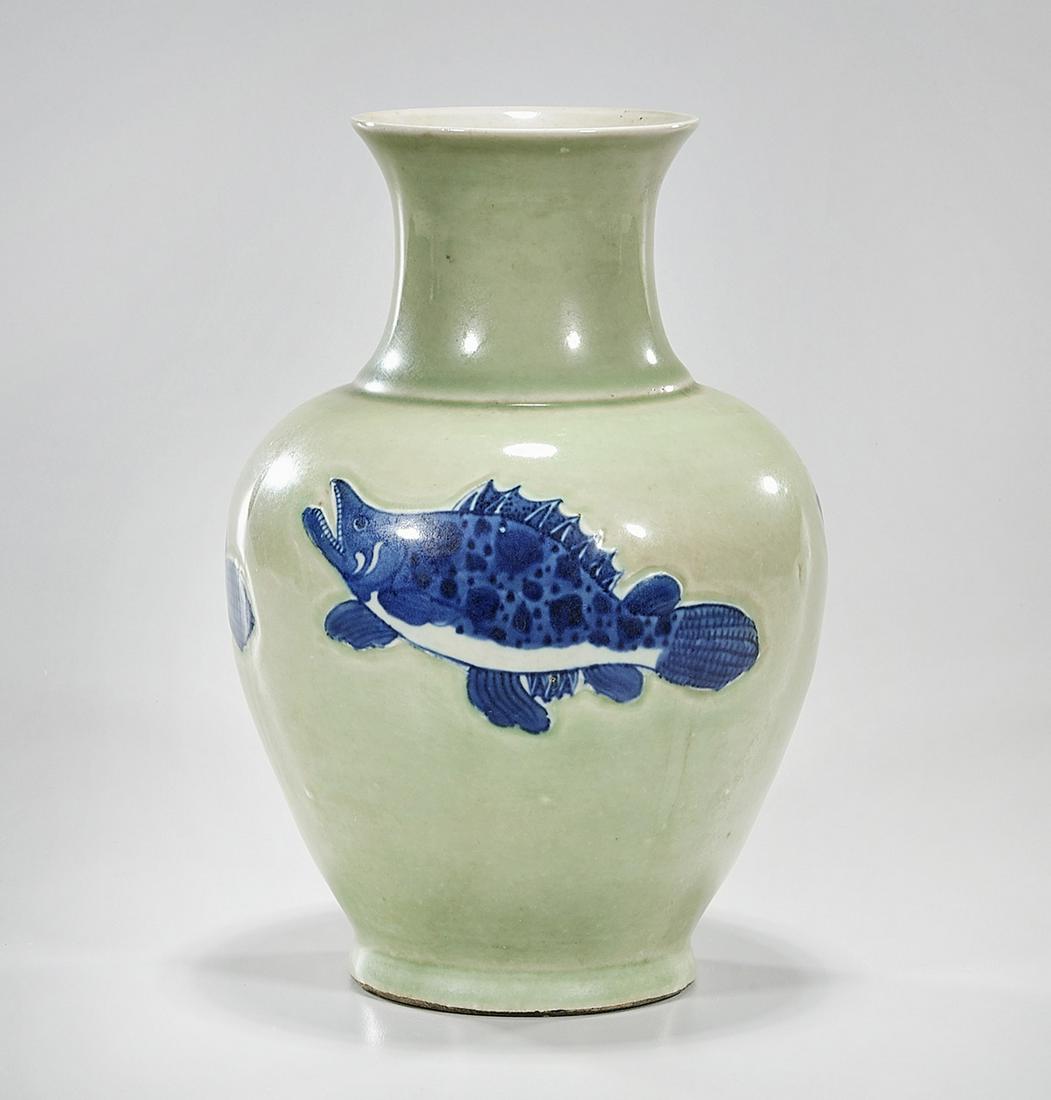 Chinese Green and Blue Porcelain Vase: Chinese green and blue porcelain vase; depicting fish; 10" x 7" (approx.) Condition: general wear, frits, pits, minor losses