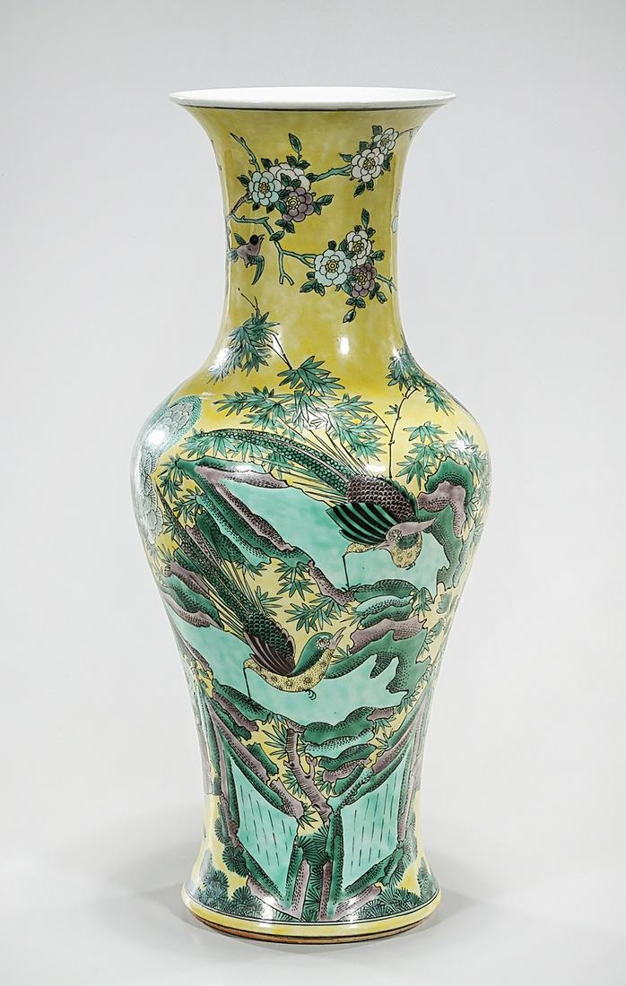 Chinese Enameled Porcelain Vase: Chinese enameled porcelain vase; yellow ground with flowers and birds; 18" x 7" (approx.) Condition: general wear, frits, pits, minor losses
