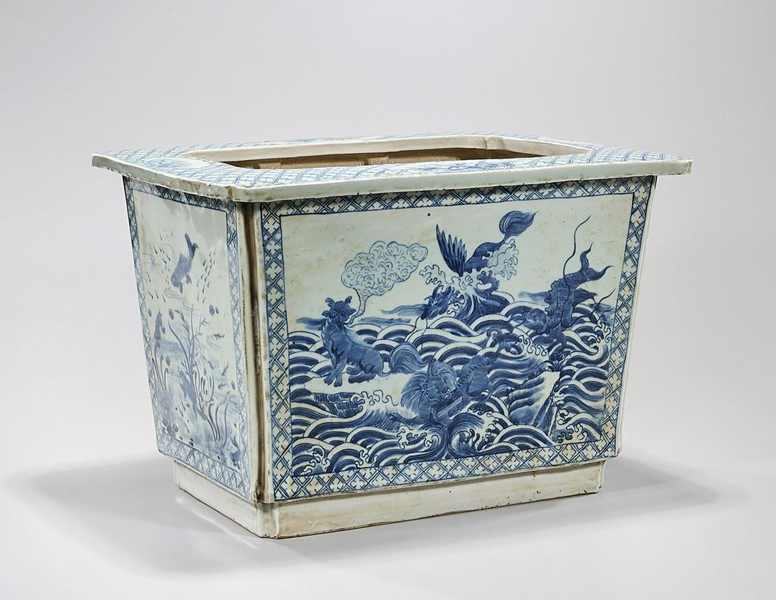 Chinese Blue and White Porcelain Planter: Chinese blue and white porcelain planter depicting water scenes, fish and other creatures; 10 1/2" x 16" x 11" (approx.) Condition: general wear, frits, pits, minor losses
