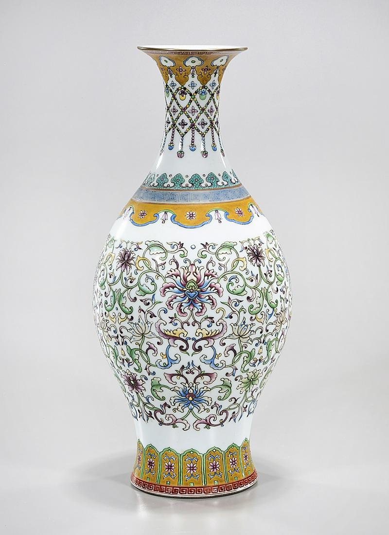 Chinese Enameled Porcelain Vase: Chinese enameled porcelain vase; floral design; 16" x 7" (approx.) Condition: general wear, frits, pits, minor losses