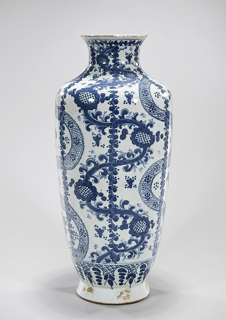Chinese Blue and White Porcelain Vase: Chinese blue and white porcelain vase; snake and floral design; 18" x 8" (approx.) Condition: general wear, frits, pits, minor losses