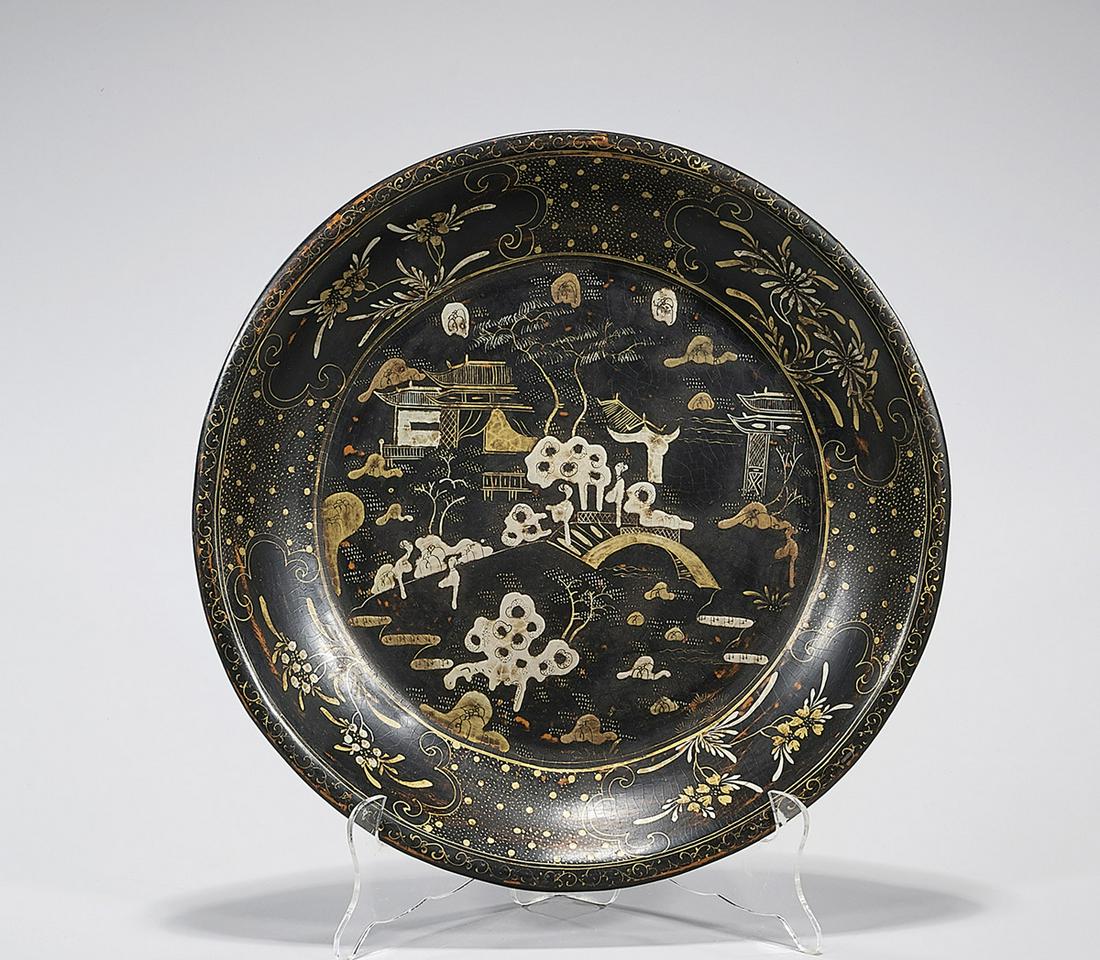 Chinese Lacquered Wood Charger: Chinese lacquered wood charger; figure and landscape design; D: 12 1/2" (approx.) Condition: general wear, frits, pits, minor losses