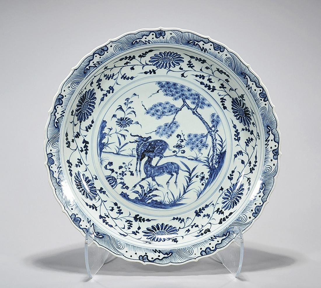 Large Chinese Blue and White Porcelain Charger: Large Chinese blue and white porcelain charger; floral and animal motif; 17" (approx.) Condition: general wear, frits, pits, minor losses