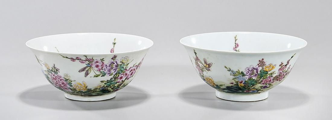 Two Chinese Enameled Porcelain Bowls: Two Chinese enameled porcelain bowls; floral design with calligraphy; mark to base; 3" x 6" (each, approx.) Condition: general wear, frits, pits, minor losses