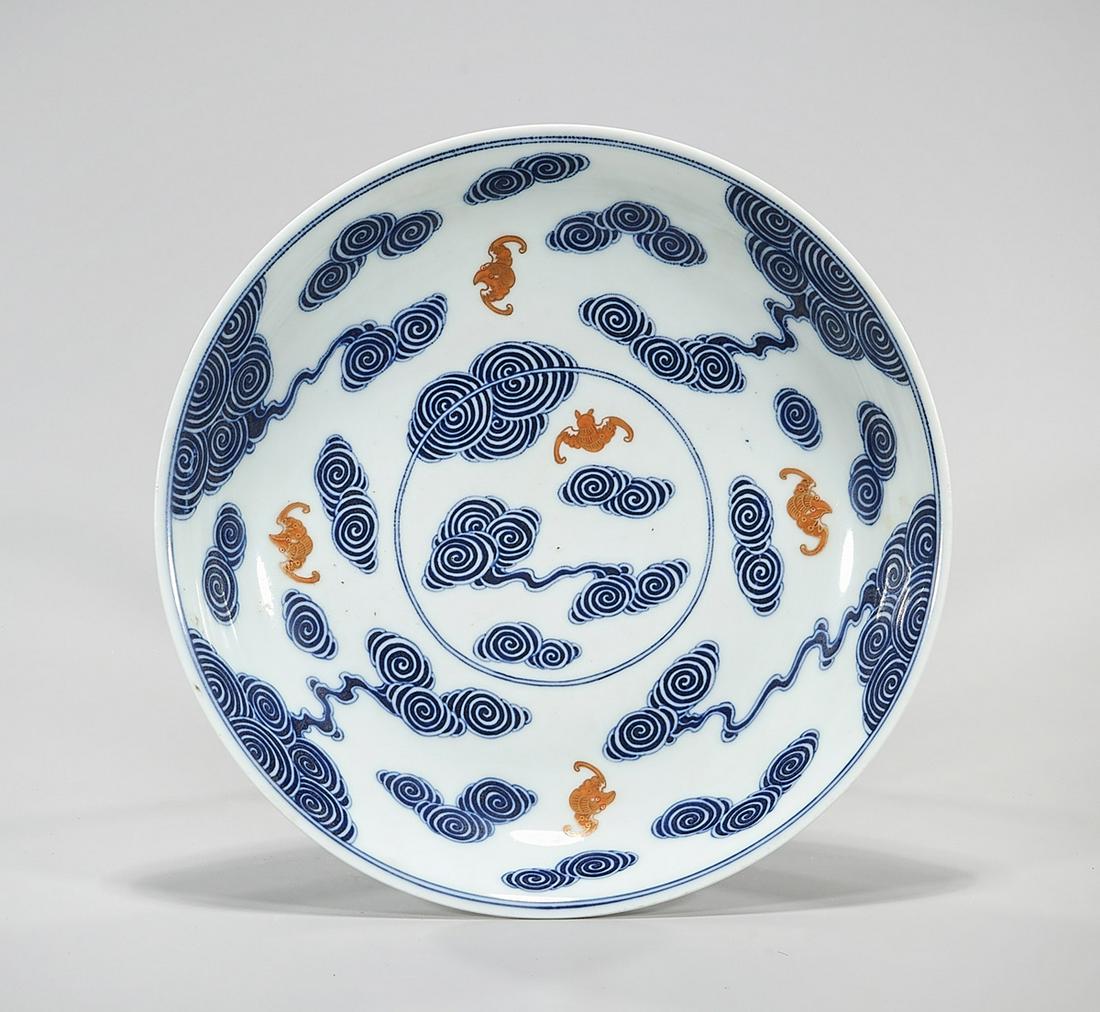 Chinese Blue, White and Red Charger: Chinese blue, white and red charger depicting bats and clouds; Guangxu mark to base; D: 11" (approx.) Condition: general wear, frits, pits, minor losses