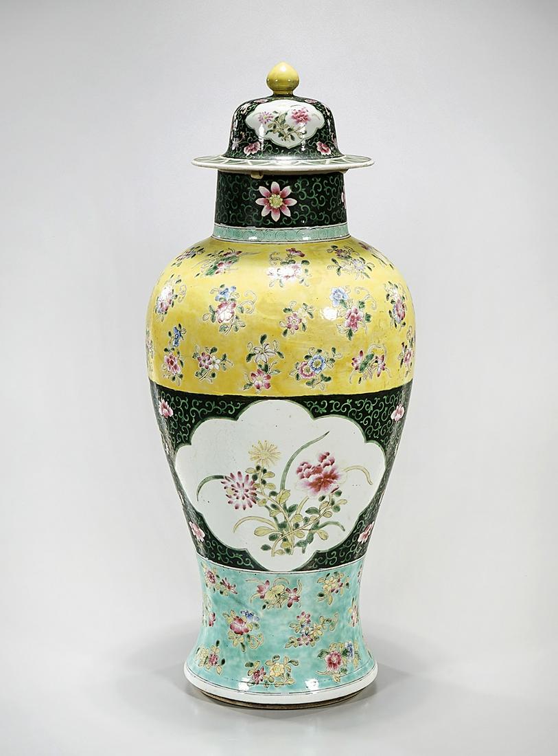Chinese Enameled Porcelain Covered Vase: Chinese enameled porcelain covered vase; floral motif; 22" x 9" (approx.) Condition: general wear, frits, pits, minor losses