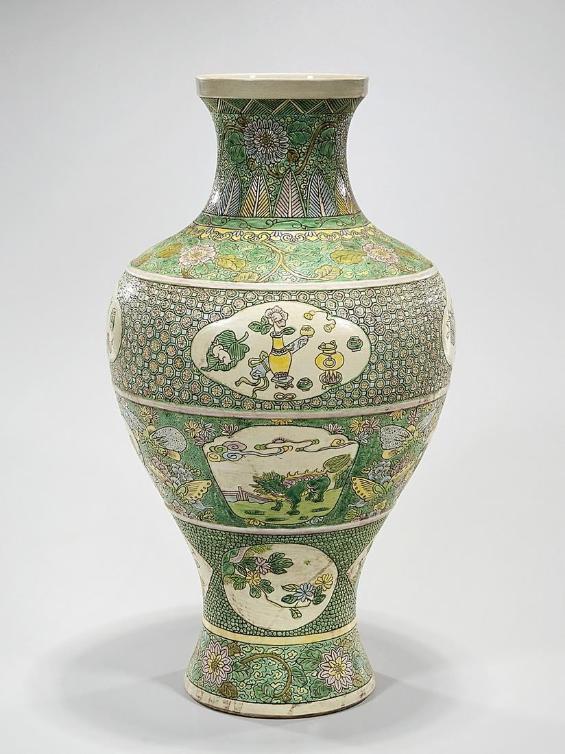 Chinese Enameled Porcelain Vase: Chinese enameled porcelain vase; green ground; horizontal registers; 19 1/2" x 10" (approx.) Condition: general wear, frits, pits, minor losses