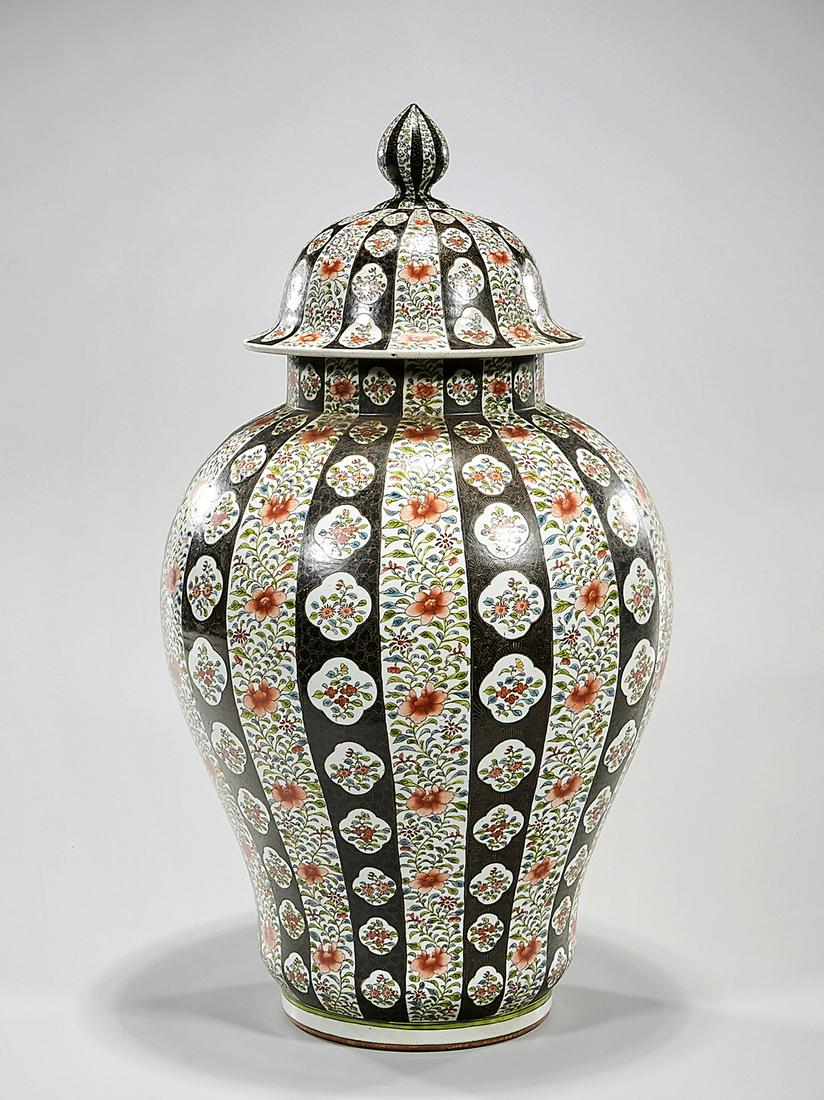 Chinese Enameled Porcelain Covered Vase: Chinese enameled porcelain covered vase; vertical registers with floral patterns; 21" x 12" (approx.) Condition: general wear, frits, pits, minor losses
