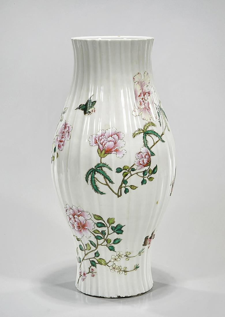 Chinese Enameled Porcelain Vase: Chinese enameled porcelain fluted vase depicting flowers; 17" x 8" (approx.) Condition: general wear, frits, pits, minor losses