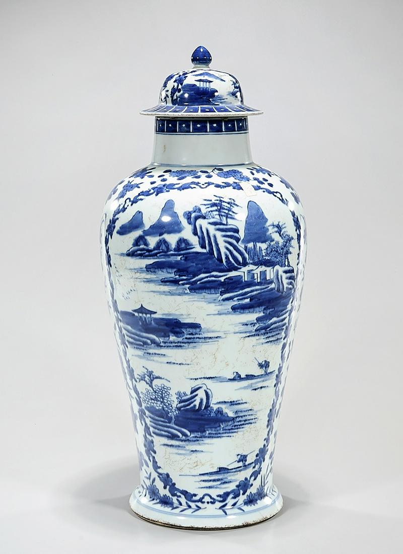 Chinese Blue and White Porcelain Covered Vase: Chinese clue and white porcelain covered vase with landscape motifs; 20 1/2" x 8 1/2" (approx.) Condition: general wear, frits, pits, minor losses