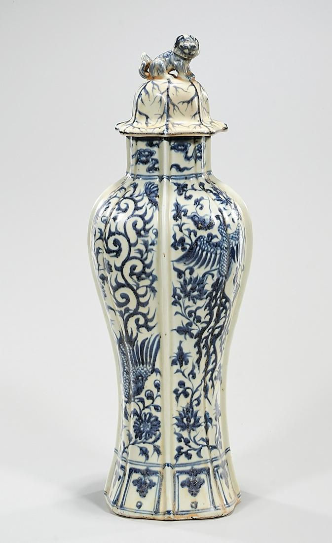 Chinese Blue and White Porcelain Covered Vase: Chinese blue and white porcelain covered vase; phoenix motifs; 18" x 6" x 4" (approx.) Condition: general wear, frits, pits, minor losses
