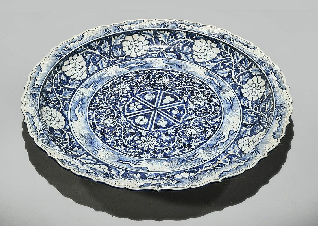 Massive Chinese Blue and White Porcelain Charger: Massive Chinese blue and white porcelain charger; floral motifs; 5 1/4" x 40" (approx.) Condition: general wear, frits, pits, minor losses