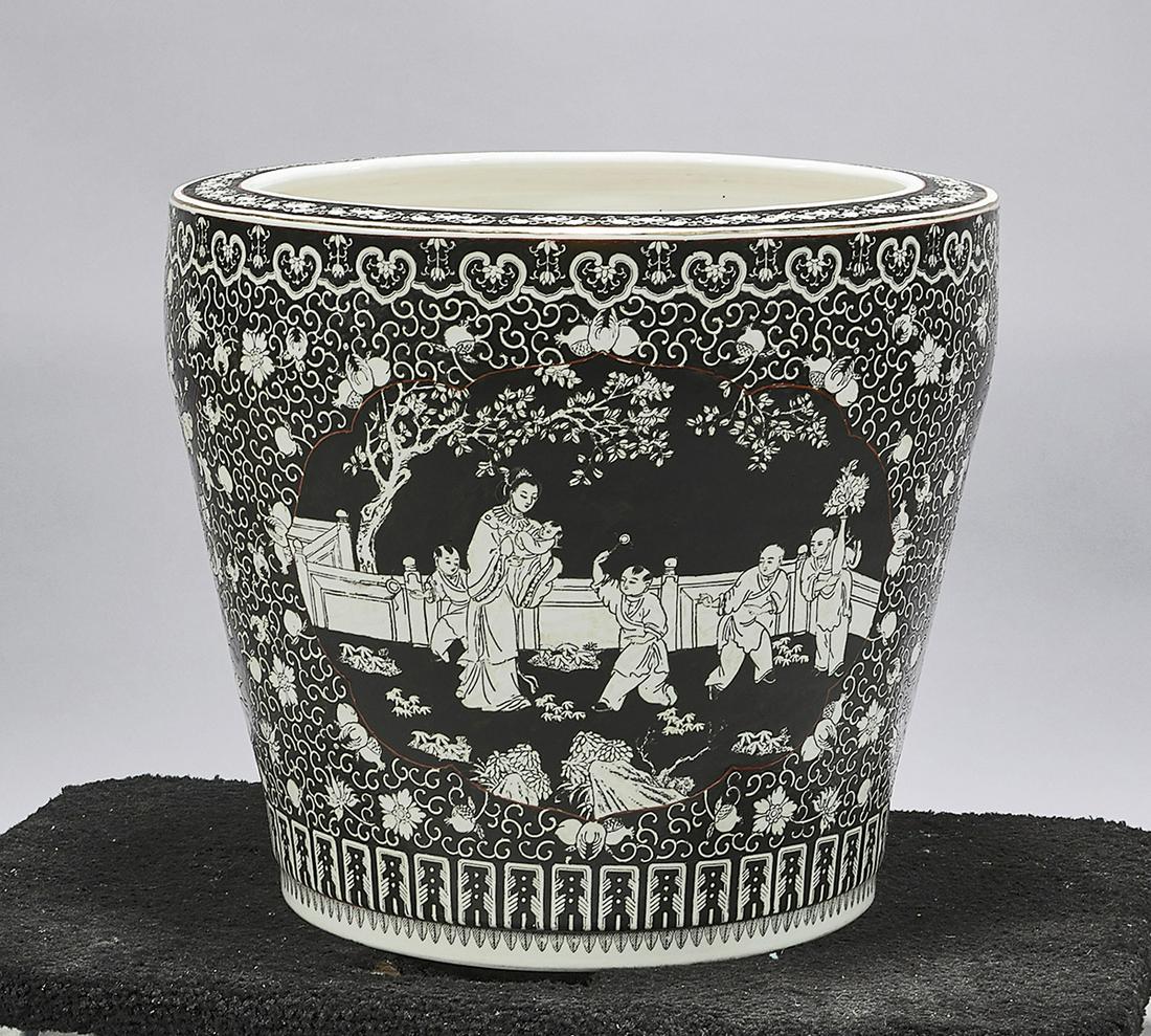 Large Chinese Enameled Porcelain Fish Bowl: Large Chinese enameled porcelain fish bowl; white on black ground; figures in a landscape; 18" x 20" (approx.) Condition: general wear, frits, pits, minor losses