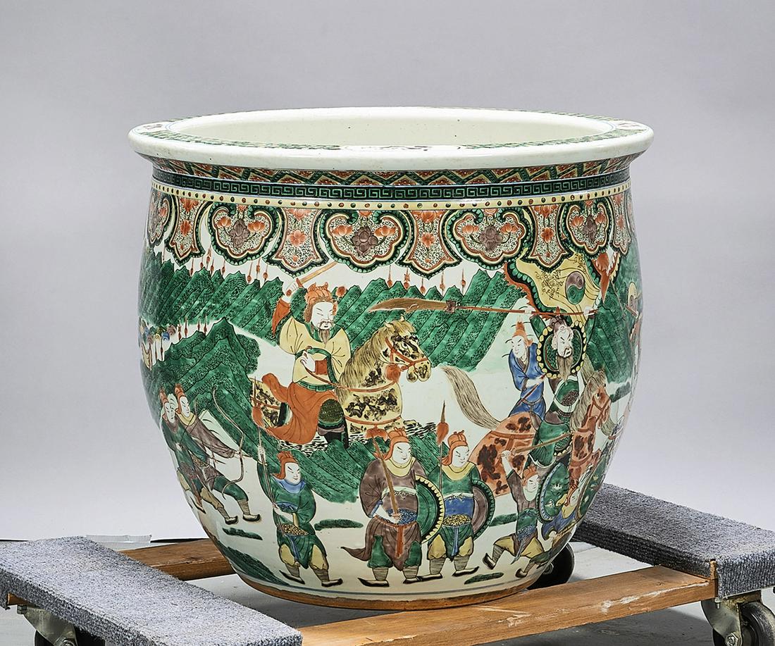 Chinese Enameled Porcelain Fish Bowl: Chinese enameled porcelain fish bowl depicting a battle scene; 19" x 21" (approx.) Condition: general wear, frits, pits, minor losses