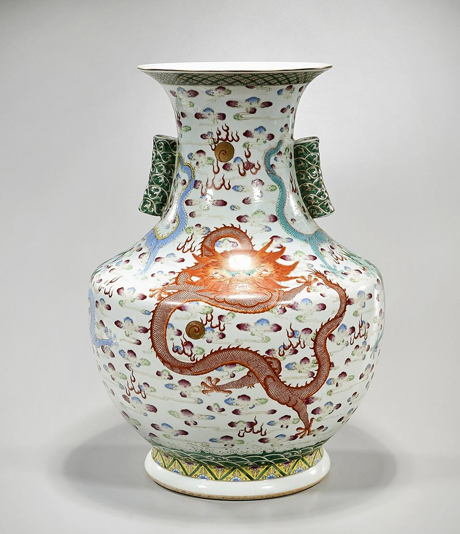 Chinese Enameled Porcelain Vase: Chinese wucai porcelain vase; dragons chasing pearls; pierced handles to neck; mark to base; 21" x 15" (approx.) Condition: general wear, frits, pits, minor losses