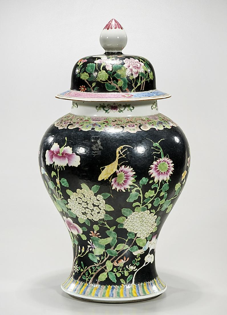 Chinese Enameled Porcelain Covered Vase: Chinese enameled porcelain covered vase; flowers and insects on black ground; concentric rings to base; 18" x 9 1/2" (approx.) Condition: general wear, frits, pits, minor losses